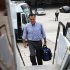Republican presidential nominee Mitt Romney leaves his campaign bus to board his charter plane in West Palm Beach, Florida