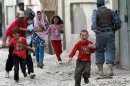 Children run away after an explosion in Kabul