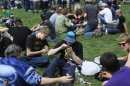 A man lights his pipe at the 4/20 pro-marijuana rally in Civic Center Park in downtown Denver