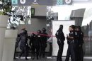 Federal police officers arrive where federal policemen were killed in a shooting at the airport in Mexico City