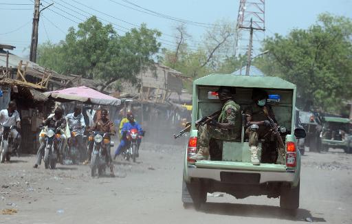 A Nigerian armoured vehicle patrols the streets of the restive northeastern city of Maiduguri, on April 30, 2013