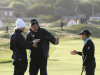Suzann Pettersen, left, and Christie Kerr, right,  talk to a rules official about the suspension of play during day two of the Women's British Open at the Royal Liverpool Golf Course, in Hoylake, England, Friday Sept. 14, 2012.  Play was suspended after about an hour of play because of strong winds that disrupted the second round so badly that organizers declared early scores "null and void."  With winds gusting to 60 mph, all the players struggled and American Cristie Kerr had her ball blown off the 12th tee three times. (AP Photo / Peter Byrne, PA) UNITED KINGDOM OUT - NO SALES - NO ARCHIVES
