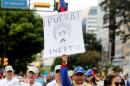 Opposition supporters take part in a rally to demand a referendum to remove Venezuela's President Nicolas Maduro in Caracas, Venezuela
