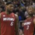 Miami Heat's LeBron James confers with Dwayne Wade during second half NBA basketball action against Toronto Raptors in Toronto on Sunday, March 17, 2013.  (AP Photo/The Canadian Press, Chris Young)