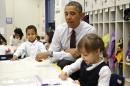 Obama interacts with children at Powell Elementary School in Washington
