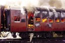 File photo of smoke pouring from the carriage of a train on fire in Godhra, in the western Indian state of Gujarat