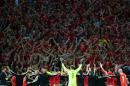 Wales players celebrate with supporters after the Euro 2016 quarter-final match between Wales and Belgium on July 1, 2016