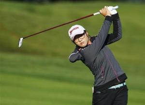 Ko of New Zealand hits an approach shot onto the 15th hole during first round of women's Evian Championship golf tournament in Evian