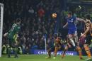 Chelsea's Gary Cahill jumps to head teh ball past Hull City's goalkeeper Eldin Jakupovic during the match at Stamford Bridge in London on January 22, 2017