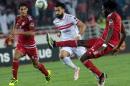 Zamalek Sporting Club's Hazem Mohammed Abdehamid Emam (white) vies with Wydad Athletic Club's Amine Atouchi (red) during ta hampions League CAF Semifinal football match on September 24, 2016 in Rabat