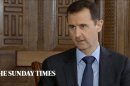 In this image taken from video filmed on Thursday, Feb. 28, 2013 and released Saturday evening, March 2, 2013, Syrian President Bashar Assad speaks during an interview with the Sunday Times, in Damascus, Syria. Iran and Syria condemned a U.S. plan to assist rebels fighting to topple Assad on Saturday and signaled the Syrian leader intends to stay in power at least until 2014 presidential elections. Assad told the Sunday Times in the interview timed to coincide with U.S. Secretary of State John Kerry's first foreign trip that "the intelligence, communication and financial assistance being provided is very lethal." Kerry announced on Thursday that the Obama administration was giving an additional $60 million in assistance to Syria's political opposition and would, for the first time, provide non-lethal aid directly to the rebels. (AP Photo/Sunday Times via AP video) THIS IMAGE IS FOR USE FOR 24 HOUR NEWS ACCESS ONLY, SUNDAY TIMES LOGO MUST NOT BE OBSCURED, NO ARCHIVES, NO SALES /PLEASE CONTACT SUNDAY TIMES SYNDICATION DEPARTMENT BY EMAIL TO ENQUIRIES@NISYNDICATION.COM FOR QUESTIONS REGARDING USE OUTSIDE THE 24 HOUR NEWS ACCESS WINDOW