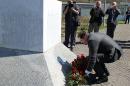 President of the Republika Srpska (the Bosnian Serb entity) Milorad Dodik lays flowers at the memorial cemetery in Potocari, near Srebrenica, on April 16, 2015
