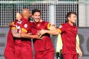 Roma's Davide Astori, center, celebrates after scoring with his teammate Maicon, left, during a Serie A soccer match between Udinese and Roma at the Friuli Stadium in Udine, Italy, Tuesday, Jan. 6, 2015. (AP Photo/Paolo Giovannini)