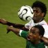 Zambia's Collins Mbesuma (bottom) is challenged by Tunisia's Radhi Jaidi during their African Nation..