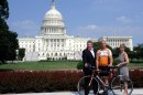 Jay Bryant, left, of the MilkPEP (Milk Processor Education Program) board of directors, injured war veteran Army Sgt. Robert Laux, center, and, Vivien Godfrey, right, CEO of MilkPEP, stand in front of the U.S. Capitol with an adaptive bicycle presented to Laux by the REFUEL I 