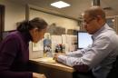 Fifty-four-years-old Natalia Pollack, uninsured since 1999, is helped to sign up for health insurance through the Affordable Care Act, by Carlos Tapia, a certified application councilor in New York City