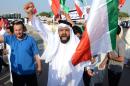 Stateless Arabs, known as bidoons, shout slogans as they protest to demand citizenship in Jahra, Kuwait, on October 2, 2012