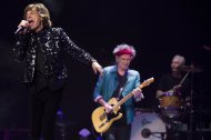 Mick Jagger, from left, Keith Richards and Charlie Watts of The Rolling Stones perform in concert on Saturday, Dec. 8, 2012 in New York. (Photo by Charles Sykes/Invision/AP)