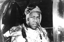 FILE - In this undated file photo from around 1950 provided by the U.S. Navy, Ensign Jesse Brown, who died in December 1950 after his plane crashed in North Korea, sits in a cockpit of his plane. Two years after he made history by becoming the Navy's first black pilot Brown lay trapped in his downed fighter plane in subfreezing North Korea, his leg broken and bleeding. His wingman crash-landed to try to save him, and even burned his hands trying to put out the flames. A chopper hovered nearby. Lt. j.g. Thomas Hudner could save himself, but not his friend. Hudner heads to Pyongyang on Saturday, July 20, 2013 with hopes of traveling in the coming week to the region known in North Korea as the Jangjin Reservoir, accompanied by soldiers from the Korean People's Army, to the spot where Brown died in December 1950. (AP Photo/U.S. Navy, File)