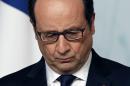 French President Francois Hollande listens to U.N. Secretary-General Ban Ki-moon during a press conference at the Elysee Palace in Paris, France, Wednesday, April 29, 2015. (AP Photo/Christophe Ena)
