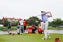 Rory McIlroy of Northern Ireland watches his tee shot on the seventh hole during the final round of the TOUR Championship by Coca-Cola at the East Lake Golf Club on September 14, 2014 in Atlanta, Georgia