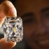 FILE- In this Oct. 4, 2012, file photo, a model holds the Archduke Joseph Diamond, a historical diamond, during a Christie's auction preview, in Geneva, Switzerland. On Tuesday, Nov. 13, 2012 Christie’s is selling the Archduke Joseph Diamond, one of the rarest and most famous. The 76.02 carat diamond, with perfect color and internally flawless clarity, came from the ancient Golconda mines in India.  It is expected to sell for more than $15 million. In 1993, Christie’s auctioned it in Geneva where it sold for $ 6.5 million. (AP Photo/Keystone, Laurent Gillieron, File)