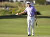 Davis Love III reacts to his putt on the 18th green during the second round of the McGladrey Classic PGA Tour golf tournament on Friday, Oct. 19, 2012, in St. Simons Island, Ga. (AP Photo/Stephen Morton)