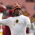 Washington Redskins quarterback Robert Griffin III tosses a ball during warmups before an NFL football game against the Cleveland Browns in Cleveland, Sunday, Dec. 16, 2012. Kirk Cousins will start in place of Griffin wgho is sitting out with a sprained knee. (AP Photo/Rick Osentoski)