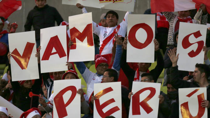 Peru&#39;s fans cheer for their team as they holding a sign that reads in Spanish: &quot;go Peru&quot; prior Copa America Group A soccer match against Venezuela at the Elias Figueroa stadium in Valparaiso, Chile, Thursday, June 18, 2015. (AP Photo/Luis Hidalgo)