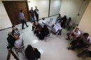 People wait for their cases to be heard at Rusafa criminal court in Baghdad