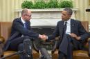 President Barack Obama, right, and Ukraine Prime Minister Arseniy Yatsenyuk, left, shake hands in the Oval Office of the White House in Washington, Wednesday, March 12, 2014. Obama welcomed Ukraine's new prime minister as the U.S. seeks to highlight ties with the former Soviet republic now caught in a diplomatic battle between East and West.(AP Photo/Pablo Martinez Monsivais)