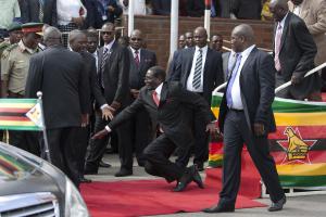 Zimbabwean President Robert Mugabe, center, falls after&nbsp;&hellip;