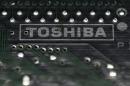 A logo of Toshiba is seen on a printed circuit board in this photo illustration taken in Tokyo