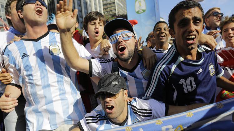 Argentina soccer fans celebrate their team&#39;s World Cup victory over Belgium, inside the FIFA Fan Fest area in Sao Paulo, Brazil, Saturday, July 5, 2014. Gonzalo Higuain&#39;s first goal of this World Cup sent Argentina into the semifinals on Saturday with a 1-0 win over Belgium