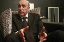 Former spy chief and presidential candidate Omar Suleiman talks during an interview with Reuters at his office in Cairo