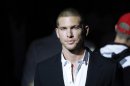 French top model Adam Senn poses prior to the Dolce & Gabbana fashion show, from the men's Spring-Summer 2013 collection, part of the Milan Fashion Week, unveiled in Milan, Italy, Saturday, June 23, 2012. (AP Photo/Luca Bruno)