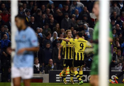 Borussia Dortmund's Reus celebrates his goal against Manchester City with team mate Lewandowski (R) during their Champions League Group D soccer match in Manchester