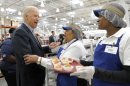 Vice President Joe Biden talks with Costco employees in the bakery section of the store while shopping at Costco in Washington, Thursday, Nov. 29, 2012. Biden went shopping for presents and to highlight the importance of renewing middle-class tax cuts so families and businesses have more certainty at this critical time for our economy. (AP Photo/Susan Walsh)