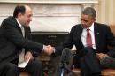 Obama shakes hands with al-Maliki after their meeting in the Oval Office at the White House in Washington
