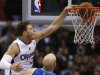 Los Angeles Clippers Griffin slam dunks over Dallas MavericksKaman during their NBA basketball game in Los Angeles