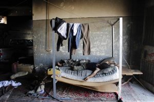 A Free Syrian Army fighter takes a rest in a safe house …