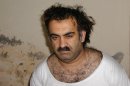 FILE- In this March 1, 2003, file photo, obtained by the Associated Press, Khalid Sheikh Mohammed, the alleged Sept. 11 mastermind, is seen shortly after his capture during a raid in Pakistan. A U.S. military judge is considering broad security rules for the war crimes tribunal of five Guantanamo prisoners, among them Khalid Sheikh Mohammed, charged in the Sept. 11 attacks, including measures to prevent the accused from publicly revealing what happened to them in the CIA's secret network of overseas prisons. The hearing will start Monday, Oct. 15, 2012. (AP Photo, file)