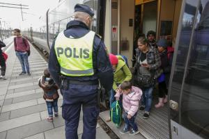 Swedish police gather a group of migrants off an incoming&nbsp;&hellip;