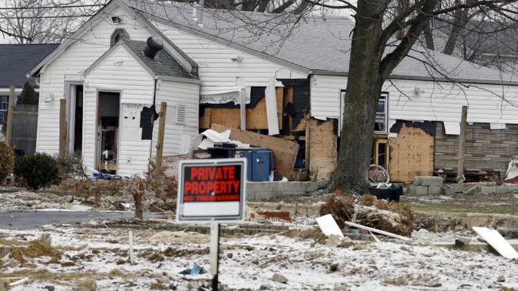 A severely damaged home is seen Tuesday, F