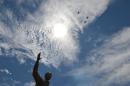Planes fly over a 9-meter bronze statue of South African former president Nelson Mandela which was unveiled on December 16, 2013 on the lawns of the Union Buildings, the seat of government in Pretoria