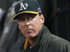 Oakland Athletics manager Melvin watches from the dugout as his team plays the Detroit Tigers in Game 4 of their MLB ALDS playoff baseball series in Oakland