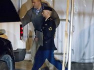 U.S. Army Private First Class Bradley Manning leaves the courthouse after his motion hearing in Fort Meade, Maryland February 28, 2013. REUTERS/Jose Luis Magana