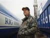 File photo of Koonce, a landman who worked cancelling leases in Michigan on behalf of Chesapeake Energy Corporation, standing near a drilling rig in Etoile, Texas