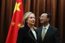 U.S. Secretary of State Hillary Rodham Clinton, left, meets with Chinese Foreign Minister Yang Jiechi, at the Ministry of Foreign Affairs in Beijing Tuesday, Sept. 4, 2012. Clinton is in Beijing to press Chinese authorities to agree to peacefully resolve disputes with their smaller neighbors over competing territorial claims in the South China Sea. (AP Photo/Feng Li, Pool)