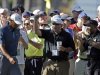 Tiger Woods is cheered by spectators as he walks up the 17th fairway during the third round of the Masters golf tournament Saturday, April 13, 2013, in Augusta, Ga. (AP Photo/David Goldman)